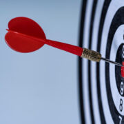 Dart hits bulls eye.