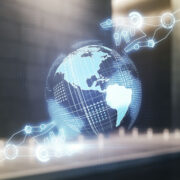 digital robot hands touching a globe.