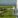 Man standing on a wind turbine.