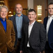 Four smartly dressed men.