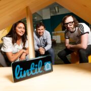 Woman and two men in house model.