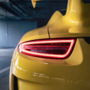Yellow sports car in a garage.