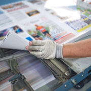 Printer examining a print run.