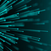 Close up of fibre cable on a green background.
