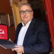 Man holding laptop.