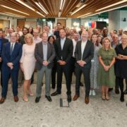 Large group of people smiling.