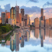 Cityscape image of Brisbane skyline during sunrise in Australia.