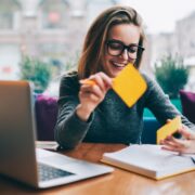 Woman using sticky notes.