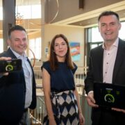 Two men and a woman at an event.