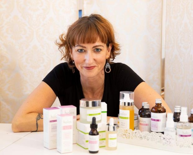 Woman with skincare products.