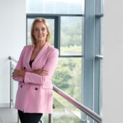 Woman wearing pink jacket.