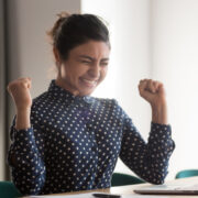 Motivated employee celebrates.
