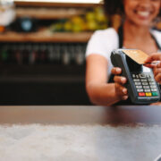 Woman making a contactless payment.