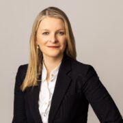 Fair-haired woman in business suit.