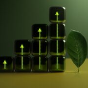 Green dice beside a leaf with arrows pointing up.