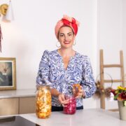 Woman preparing food in kitchen.