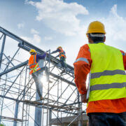 People in hi-vis clothing on a construction site.