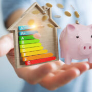 Savings from energy efficiency going into a piggy bank.
