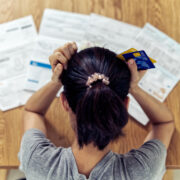 Person stressing over bills.