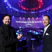 Two men at awards ceremony.