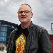 Man standing in front of building in Dublin.