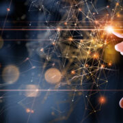 Hand touching digital information.