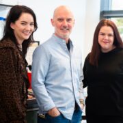 two women and a man in a lab.