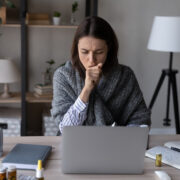 Sick worker coughing.