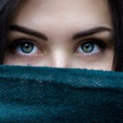 Close-up of woman with green eyes.