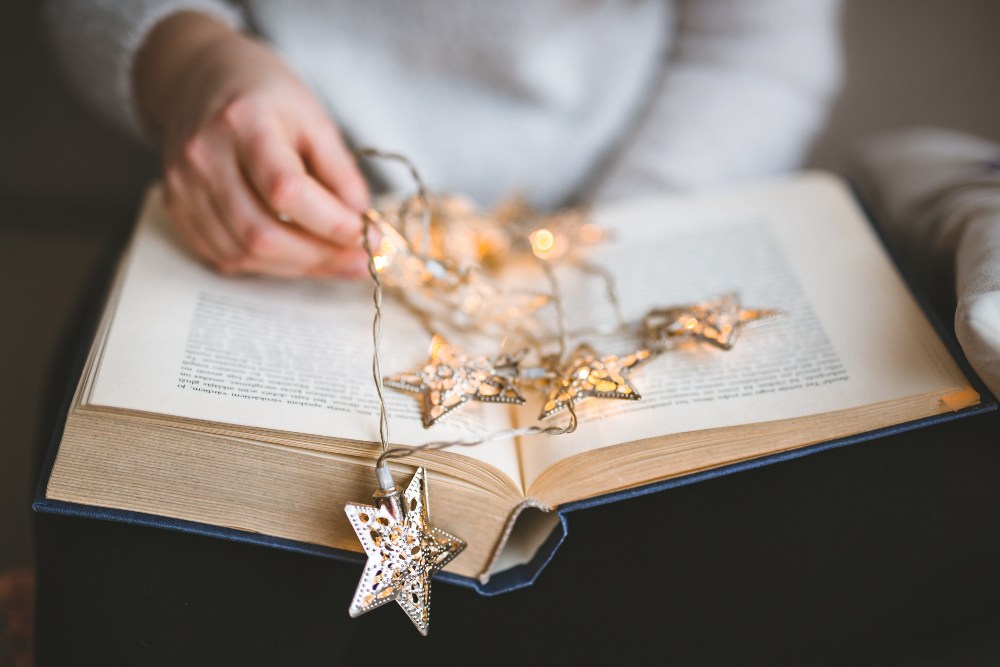 Christmas decorations on an open book.