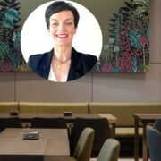 Woman inset on image of cafe.