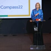 Woman speaking from a podium.