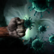 Irish flag on a fist beating Covid.