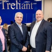 Four men in an office.