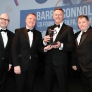 Four men in tuxedos.