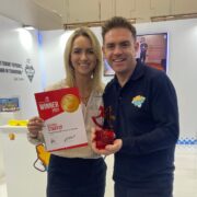 Woman and man at an event.