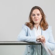 Woman in pale blue blazer.