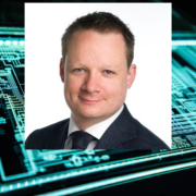 Man inset on image of green and black circuit board.