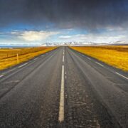 road leading to snowy mountains.