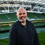 Man standing in stadium.