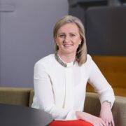 Woman in white blouse.