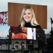 Woman inset on digital billboards in London.