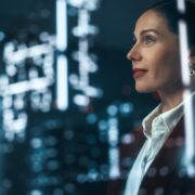 Woman executive looking out at a city.
