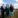 Man and two woman at a wind farm.