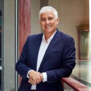 Man wearing navy blazer.