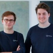 Two men in navy sweatshirts.