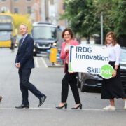 Men and women crossing the road.
