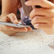 Woman making payment via phone.