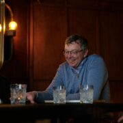 Three men at a table.