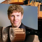Man inset on image of industrial vehicle.